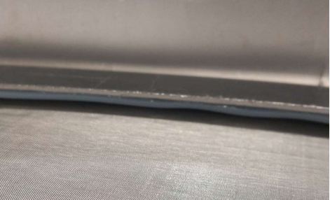 Close-up of vibro-sieve gasket sealing between frame and mesh screen