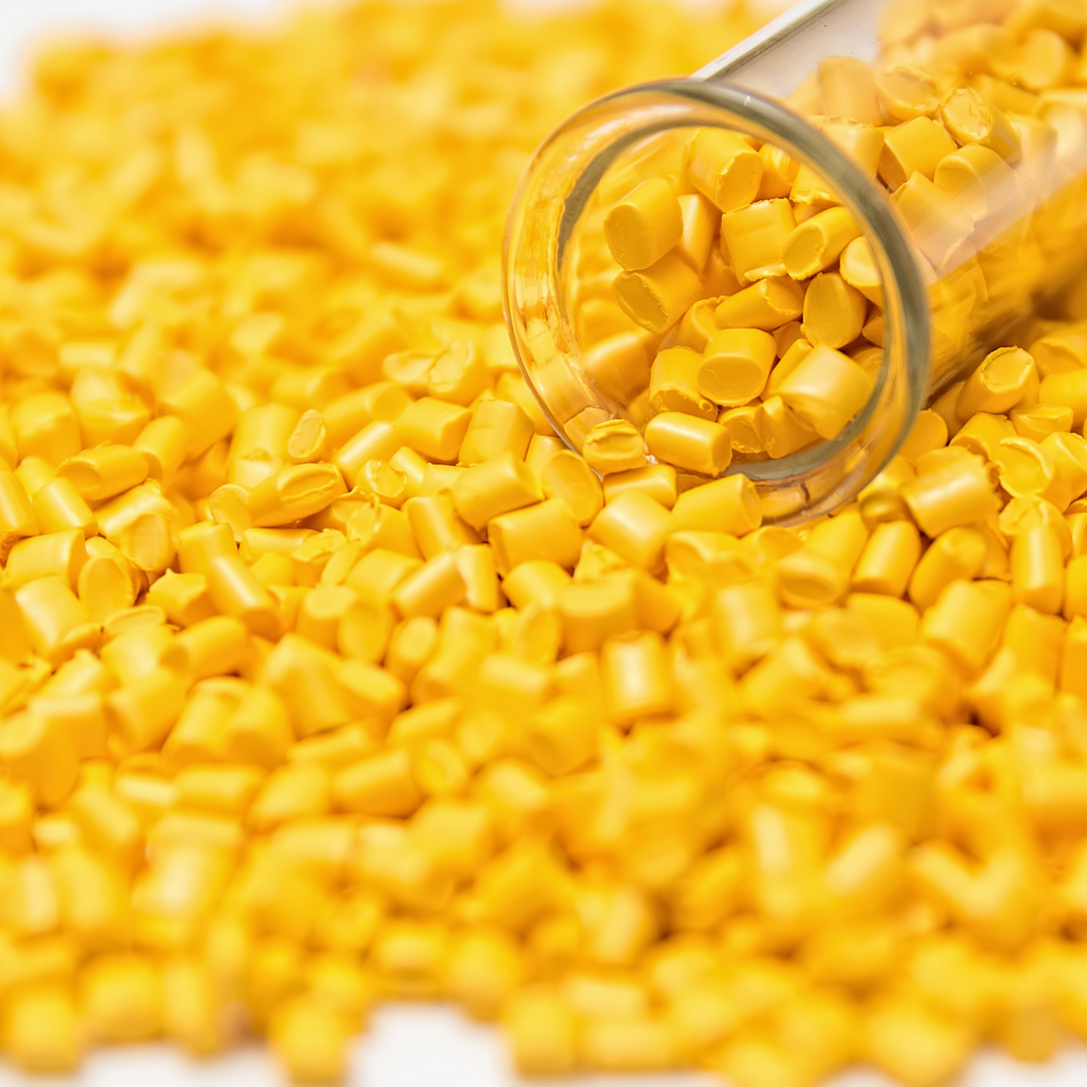 Yellow polymer pellets and plastic granules