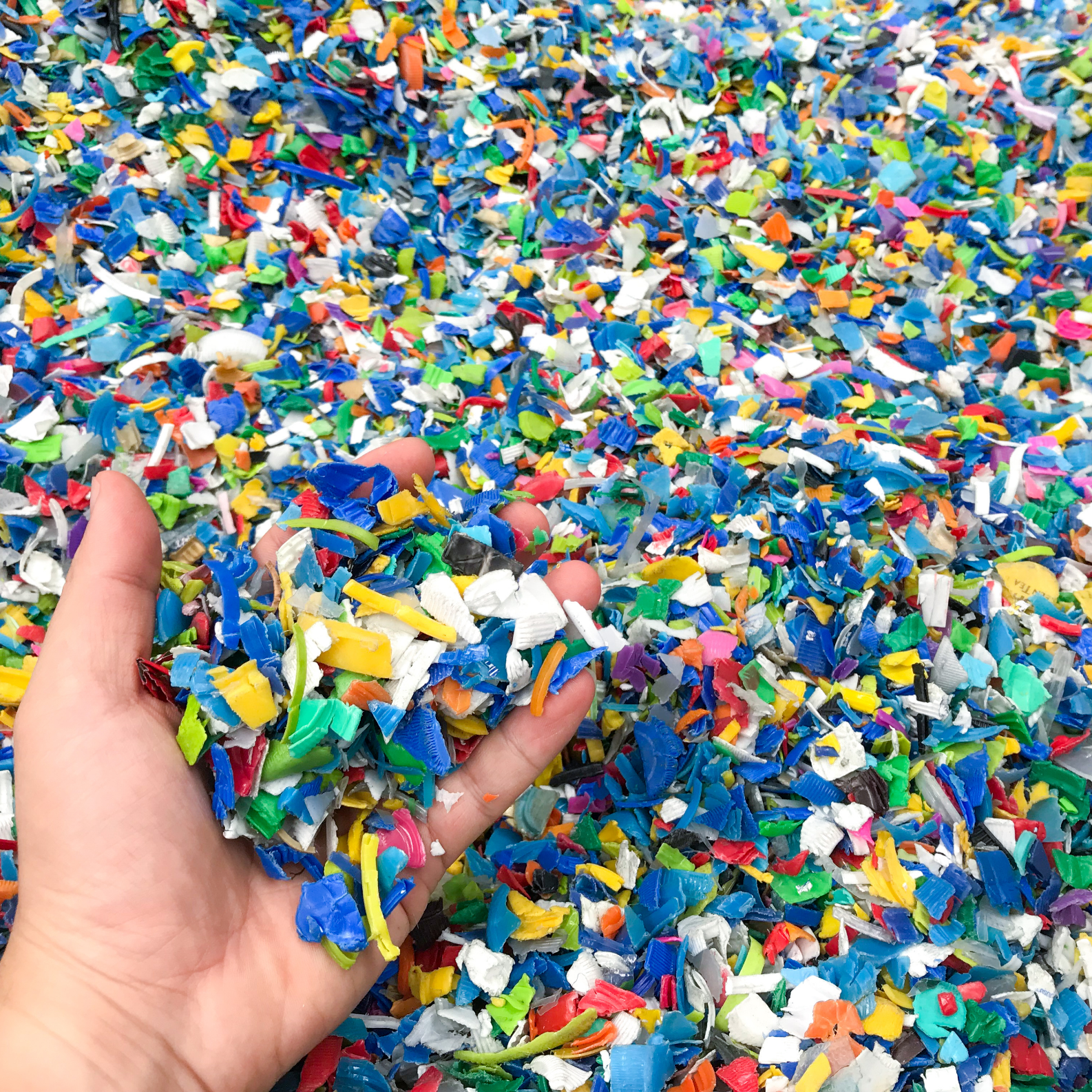Plastic regrind from rejected moulded parts ready for particle size classification.
