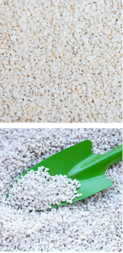 Expanded perlite granules close-up with a garden scoop